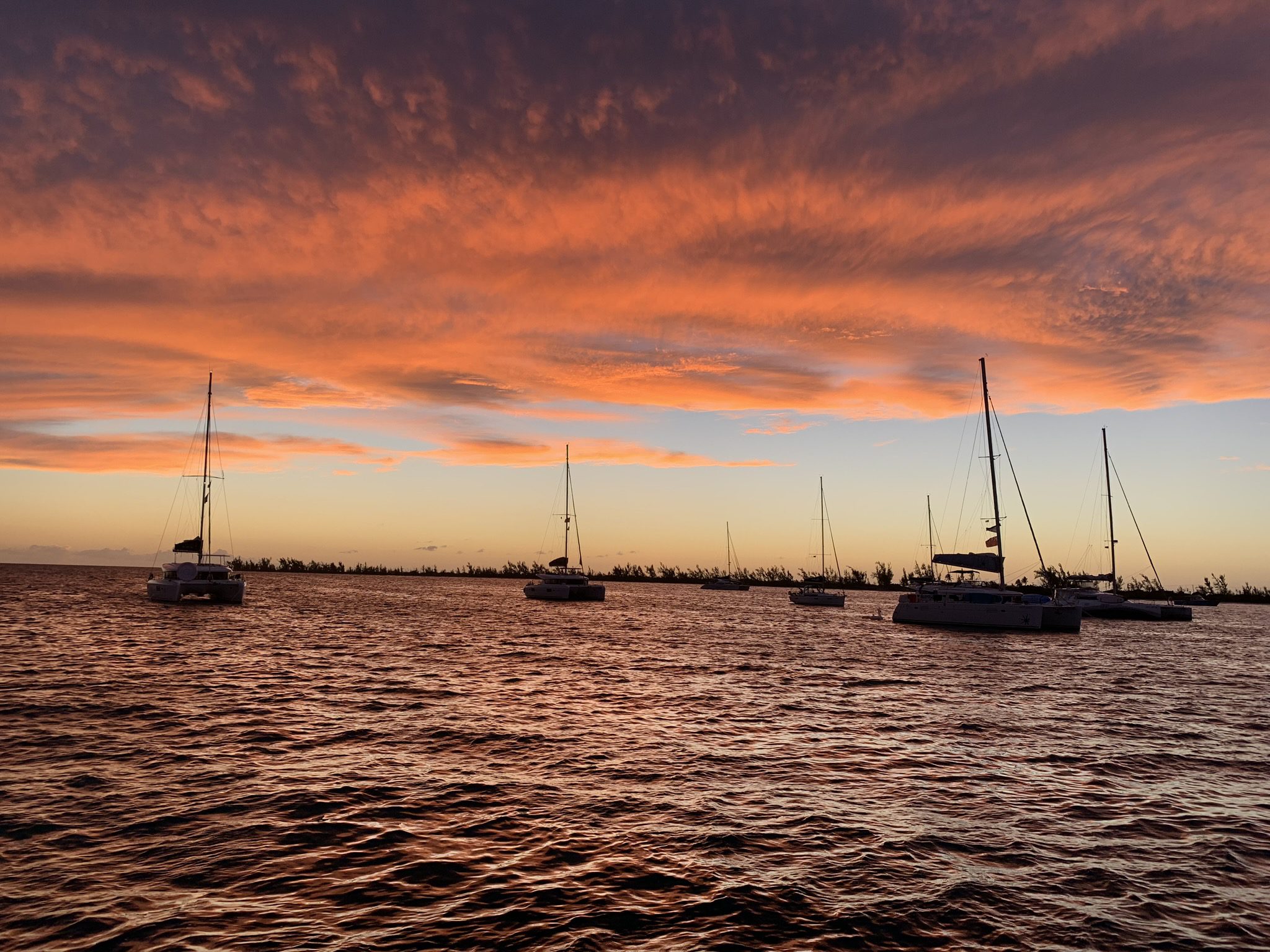 Caribbean sunset with sailboats